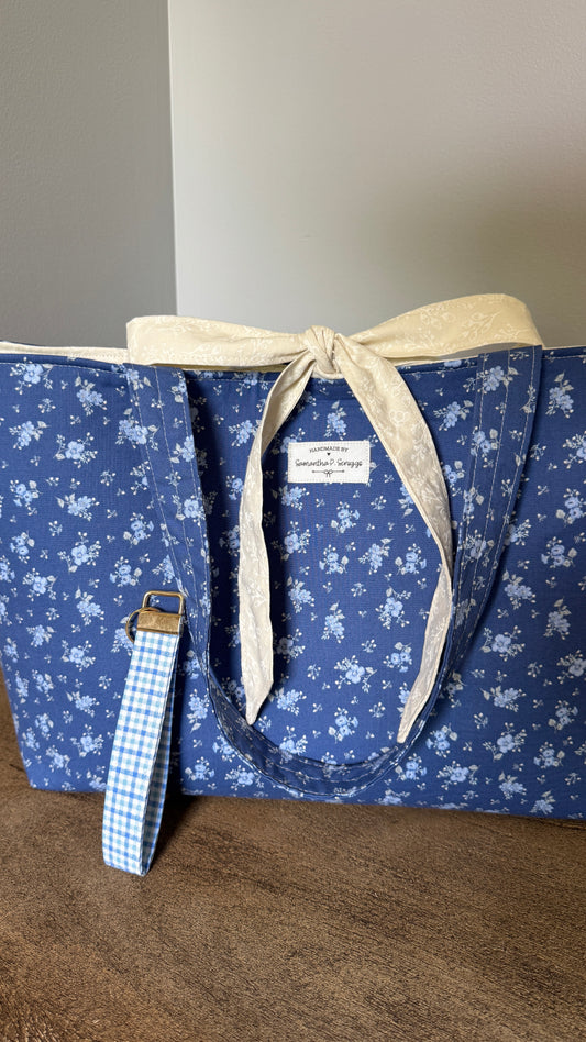 (1 left out of 2)Handmade By Samantha XL Tote Bag: Dusty Blue Floral With Bow Tie Closure and Matching Handmade Wristlet Key Ring